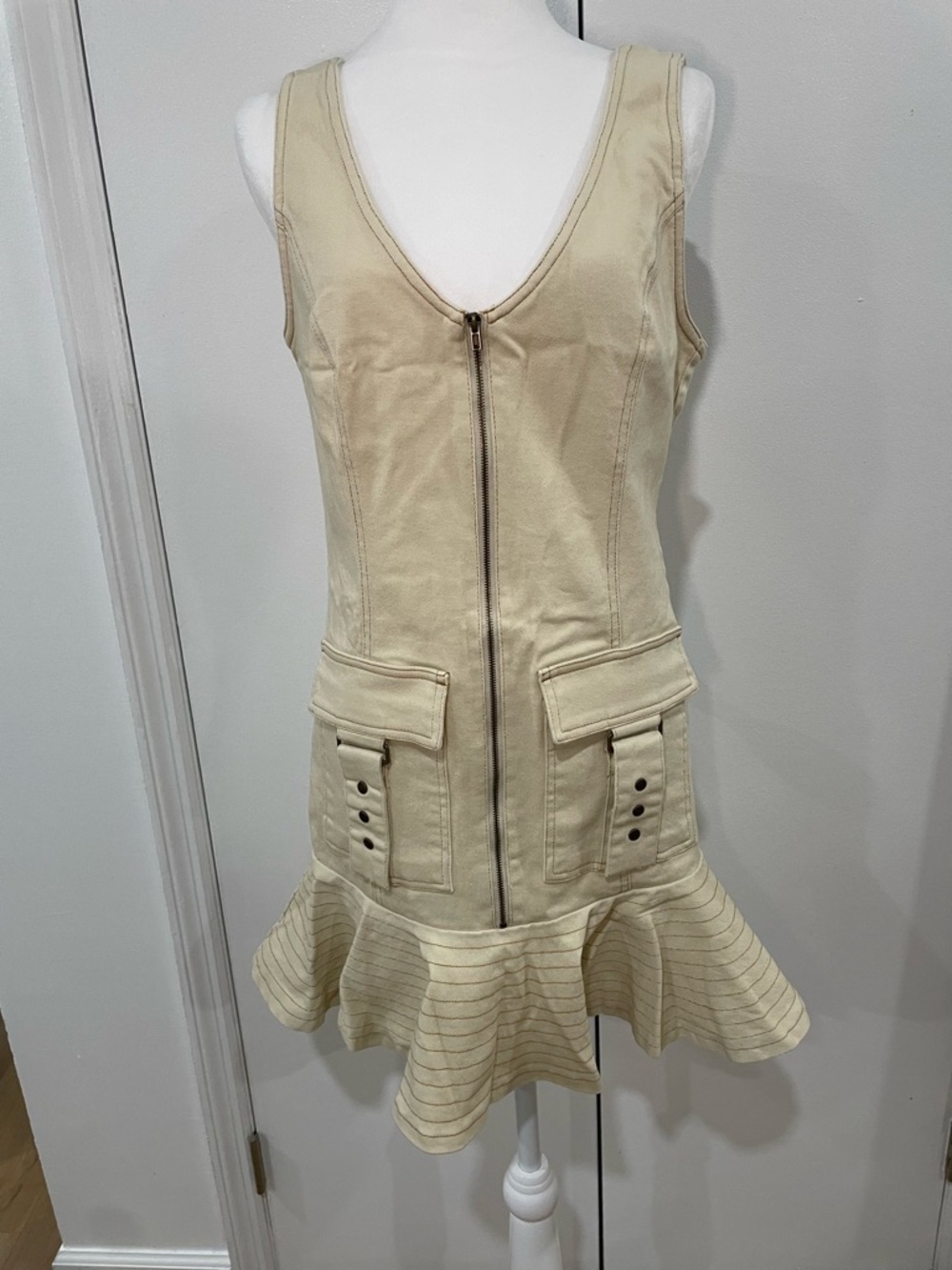Sleeveless Zip-Front Ruffle Hem Dress in Cream